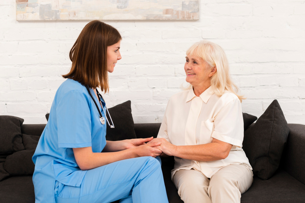Home health nurse caring for a patient at home